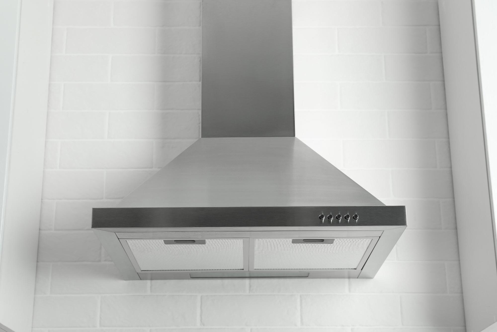 Cooker Hood Against White Brick Wall Kitchen