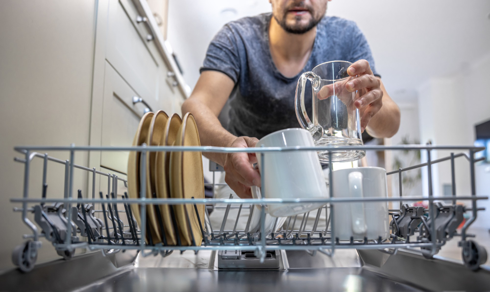 Man using Integrated Dishwasher
